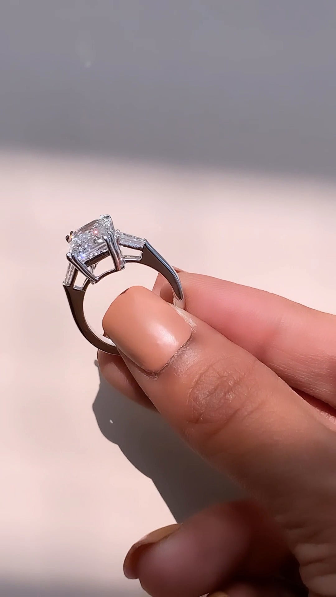 Calliope Emerald Three Stone Moissanite Engagement Ring