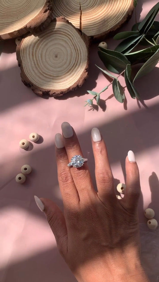 Calliope Round Three Stone Moissanite Engagement Ring