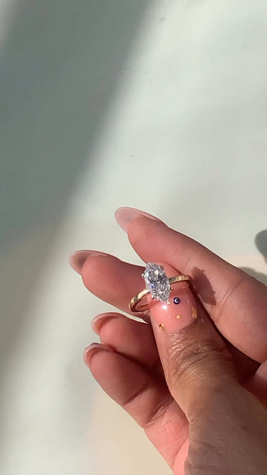 Penelope Two Tone Marquise Hidden Halo Moissanite Engagement Ring