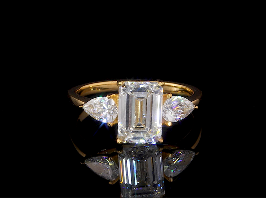 Verity Emerald Three Stone Moissanite Engagement Ring